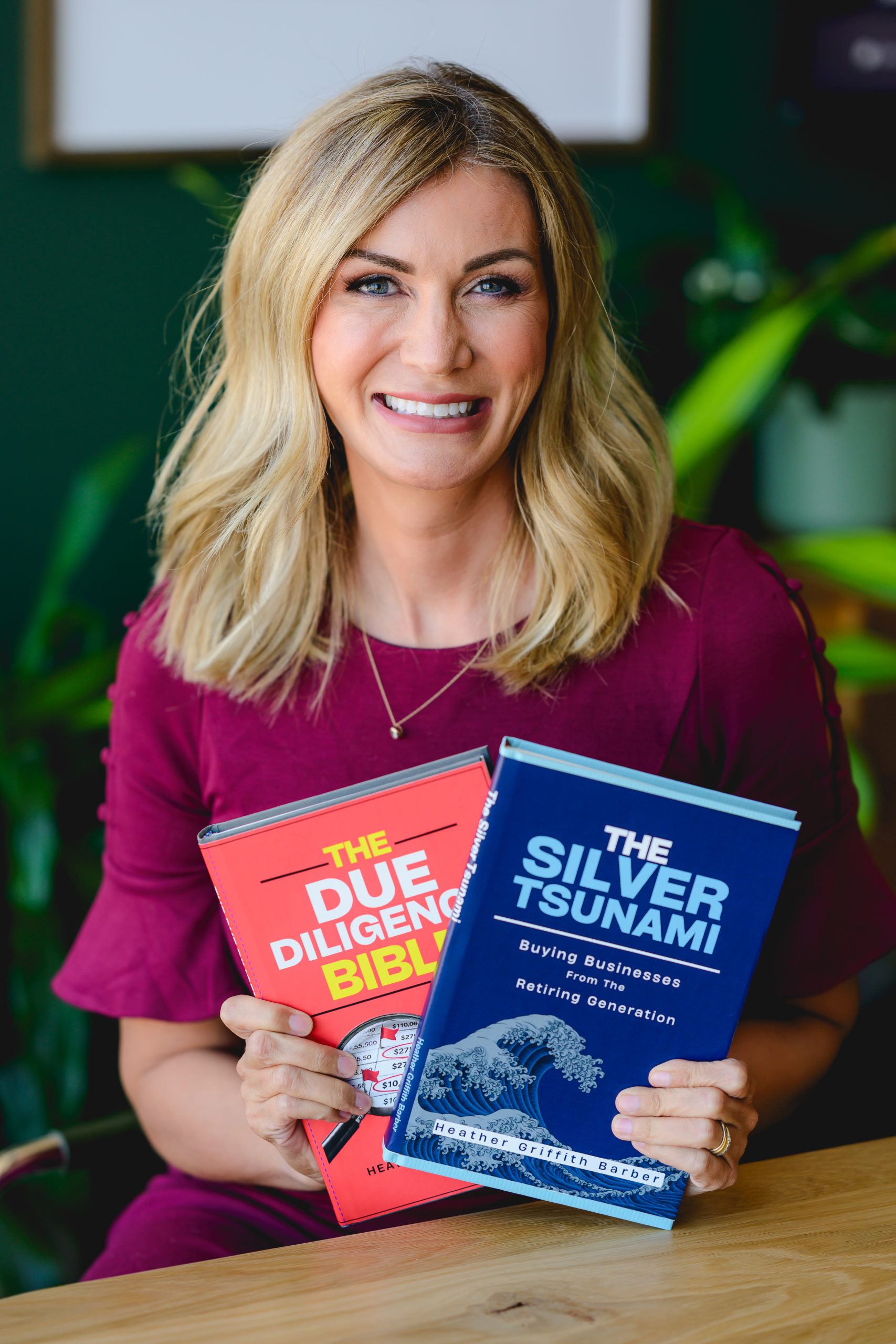 Heather Griffith Barber holding copies of her books